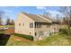 Beautiful tan townhouse with well-manicured lawn and ample natural light from the windows and skylights at 13913 Queens Harbor Rd, Charlotte, NC 28278