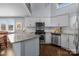 Well-equipped kitchen with granite countertops, stainless appliances, and white cabinetry at 13913 Queens Harbor Rd, Charlotte, NC 28278