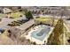 Aerial shot of a community pool, partially covered and surrounded by trees and landscaping at 13913 Queens Harbor Rd, Charlotte, NC 28278