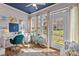 Inviting sunroom with ample natural light and a tranquil workspace, enhanced by scenic views at 13913 Queens Harbor Rd, Charlotte, NC 28278