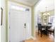 A bright and airy home entrance with beautiful flooring and a dining area at 14014 Acorn Creek Ln, Charlotte, NC 28269