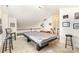 This upper game room is ready for fun with a pool table and stools for seating at 14014 Acorn Creek Ln, Charlotte, NC 28269