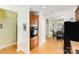 Bright kitchen area featuring wood floors, oven and view of eat-in breakfast area at 14014 Acorn Creek Ln, Charlotte, NC 28269