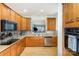 Stylish kitchen featuring stainless steel appliances, tile backsplash, and sleek design at 14014 Acorn Creek Ln, Charlotte, NC 28269