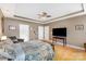 Cozy main bedroom with tray ceiling, wood floors, neutral colors, and ample space at 14014 Acorn Creek Ln, Charlotte, NC 28269