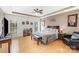 Spacious main bedroom features a tray ceiling, wood floors, and natural light at 14014 Acorn Creek Ln, Charlotte, NC 28269