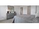 Bedroom with carpet, neutral decor, and bed with gray linens at 1420 6Th Ne St, Hickory, NC 28601