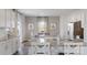 Modern kitchen featuring granite countertops, white cabinets, and stainless steel appliances at 1420 6Th Ne St, Hickory, NC 28601