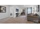 Open concept living room with neutral colors, carpet and large window, and furnishings for seating at 1420 6Th Ne St, Hickory, NC 28601
