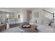 Open-concept living area with a modern sectional, hardwood floors, and an adjacent dining area at 1420 6Th Ne St, Hickory, NC 28601