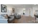 Upstairs living room with comfortable seating, neutral colors, carpet, and artwork at 1420 6Th Ne St, Hickory, NC 28601