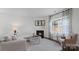Cozy living room with a fireplace, comfortable seating, and large windows providing natural light at 1420 6Th Ne St, Hickory, NC 28601