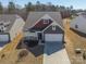 Aerial view of craftsman style home featuring a well maintained lawn and a two car garage at 168 Kennerly Center Dr, Mooresville, NC 28115