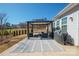 Well-maintained backyard featuring a patio with outdoor seating and a grill, perfect for gatherings at 168 Kennerly Center Dr, Mooresville, NC 28115