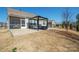 Spacious backyard with a screened-in porch and patio, providing ample space for outdoor activities at 168 Kennerly Center Dr, Mooresville, NC 28115
