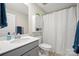 Bright bathroom featuring a single sink vanity, matching fixtures, and a shower-tub combination at 168 Kennerly Center Dr, Mooresville, NC 28115