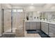 Well-lit bathroom featuring a glass shower and double vanity at 168 Kennerly Center Dr, Mooresville, NC 28115
