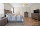 Light-filled bedroom features a ceiling fan and light wood flooring at 168 Kennerly Center Dr, Mooresville, NC 28115