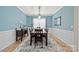 Dining room features a large table, modern light fixture, and a contemporary rug at 168 Kennerly Center Dr, Mooresville, NC 28115
