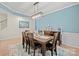 Dining room features a large table, modern light fixture, and a contemporary rug at 168 Kennerly Center Dr, Mooresville, NC 28115