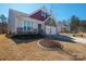 Traditional home featuring a manicured lawn with mulch beds and craftsman style architecture at 168 Kennerly Center Dr, Mooresville, NC 28115