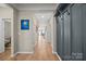 Hallway featuring hard wood floors, and an open floor plan at 168 Kennerly Center Dr, Mooresville, NC 28115