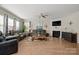 Inviting living room with a fireplace, comfortable seating, and plenty of natural light at 168 Kennerly Center Dr, Mooresville, NC 28115