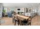 Open concept floor plan of the dining room, kitchen, and living room with wood floors at 168 Kennerly Center Dr, Mooresville, NC 28115