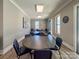This meeting room is equipped with round tables, black chairs, and natural light at 168 Kennerly Center Dr, Mooresville, NC 28115