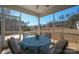 Inviting screened-in porch offering a tranquil space with outdoor seating and scenic backyard views at 168 Kennerly Center Dr, Mooresville, NC 28115