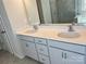Bathroom with a double vanity, stone counter, and gray shaker cabinets at 1708 Honey Trl, Monroe, NC 28112