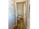 Compact half bath with a modern toilet and wood-style flooring at 1708 Honey Trl, Monroe, NC 28112