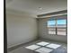 Primary bedroom with natural light from window; prepped for new floors at 1708 Honey Trl, Monroe, NC 28112