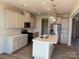 Spacious kitchen with stainless appliances, stone counters, and kitchen island at 1708 Honey Trl, Monroe, NC 28112
