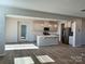 Open kitchen featuring stainless steel appliances, large island, and pendant lighting at 1708 Honey Trl, Monroe, NC 28112