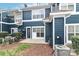A backyard featuring a door, bushes, windows and air conditioner at 17537 Tuscany Ln, Cornelius, NC 28031