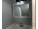 Stylish powder room with a modern vanity, mirror, and lighting fixtures at 17537 Tuscany Ln, Cornelius, NC 28031