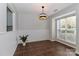 Bright dining room with large window, tile floors and bead board trim at 17537 Tuscany Ln, Cornelius, NC 28031