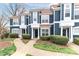Charming blue townhouse exteriors with well-manicured front lawns and inviting entrances at 17537 Tuscany Ln, Cornelius, NC 28031