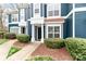 Well-maintained townhome with landscaped front yard and inviting entrance at 17537 Tuscany Ln, Cornelius, NC 28031