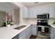 Bright kitchen featuring stainless steel appliances, and light blue cabinetry at 17537 Tuscany Ln, Cornelius, NC 28031