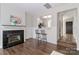 Cozy living room with a fireplace, breakfast bar into kitchen and hardwood floors at 17537 Tuscany Ln, Cornelius, NC 28031