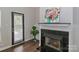 A living room featuring a fireplace and a flower painting at 17537 Tuscany Ln, Cornelius, NC 28031