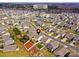 Aerial view of home showcasing community pool, streets, and neighborhood amenities at 181 Atwater Landing Dr, Mooresville, NC 28117