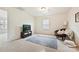 Neutral bedroom with a cozy sitting area and plenty of natural light at 181 Atwater Landing Dr, Mooresville, NC 28117