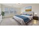 Bright bedroom with plush carpet, large windows, and elegant furnishings at 181 Atwater Landing Dr, Mooresville, NC 28117