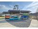 Kayaks neatly stored under metal canopies on a gravel lot near a lake at 181 Atwater Landing Dr, Mooresville, NC 28117