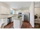 Modern kitchen with white cabinets, stainless steel appliances, granite countertops, and a central island at 181 Atwater Landing Dr, Mooresville, NC 28117