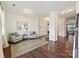 Bright living room with hardwood floors, neutral paint, area rug, and elegant furniture at 181 Atwater Landing Dr, Mooresville, NC 28117