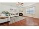 Cozy living room with hardwood floors, a fireplace, large window, and comfortable white sofa at 181 Atwater Landing Dr, Mooresville, NC 28117